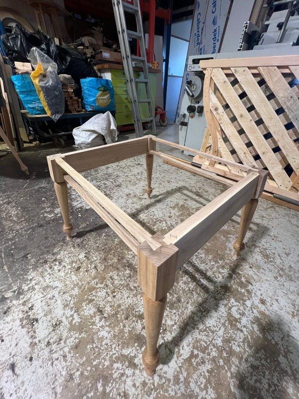 Lengths of hardwood with hand-cut joints prepared in the workshop